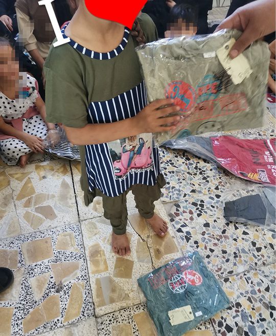 album – joy of Eid -Distribution of Eid clothing – Baghdad – 2485